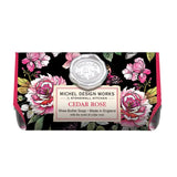 A bar of MD Cedar Rose soap with floral design and a metal lid, placed against a white background.