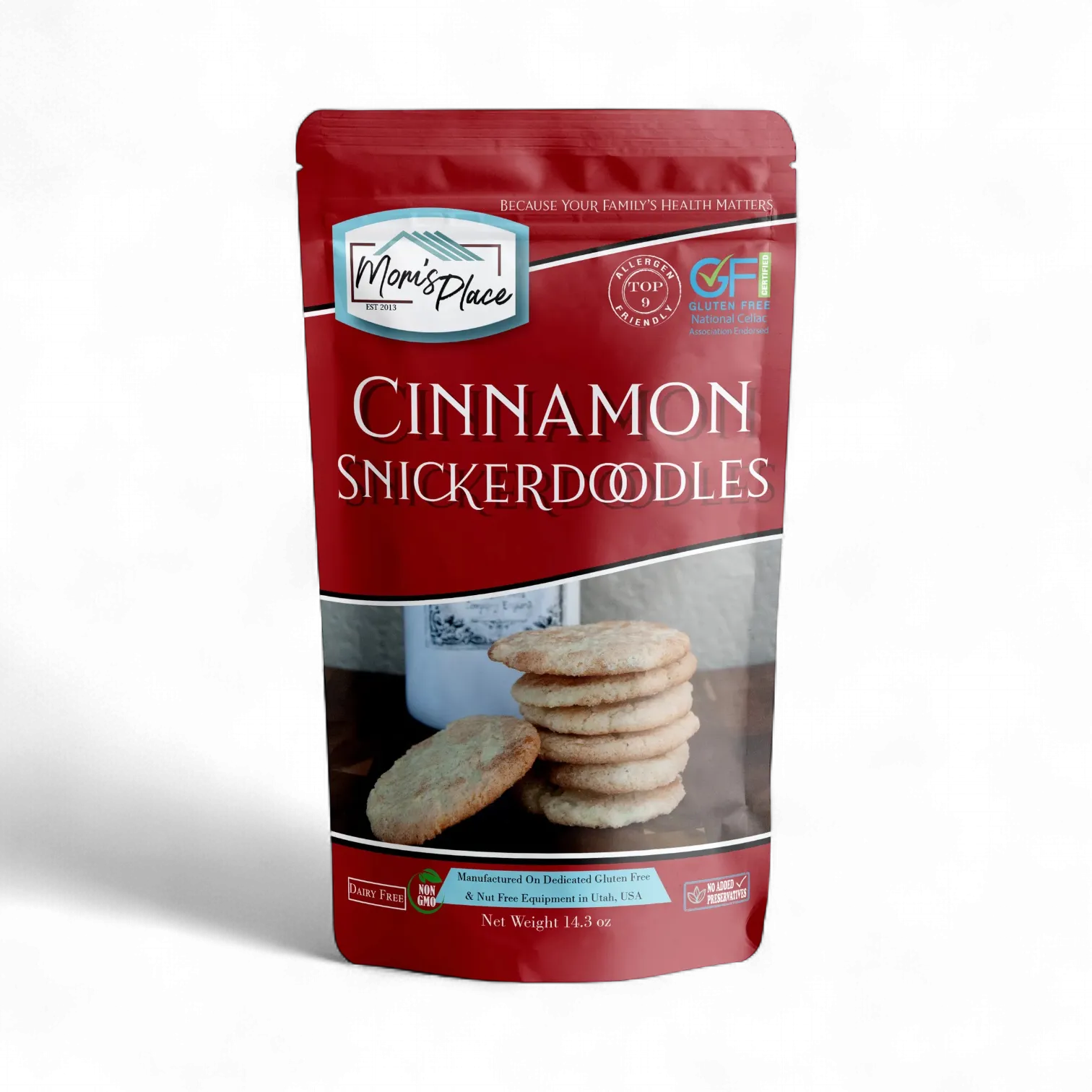 A stand-up pouch of Mon's Place Cinnamon Snickerdoodles on a clean white background. The packaging is primarily dark red with white text and a photo of the cookies on the front.