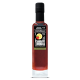 A bottle of Olivelle Strawberry Lemonade infused barrel aged balsamic vinegar, featuring a black cap and a black label with a strawberry and lemon graphic, set against a plain white background.