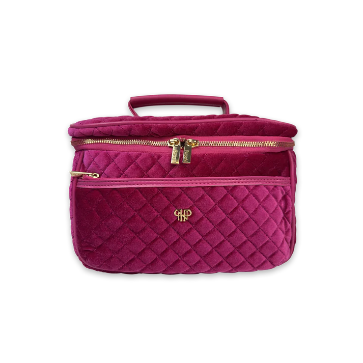 Quilted pink handbag with gold zipper and logo on a white background