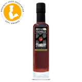 Bottle of Olivelle strawberry balsamic vinegar with a Specialty Food Association award logo.