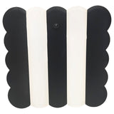 Black and white electronic device with a button on a white background