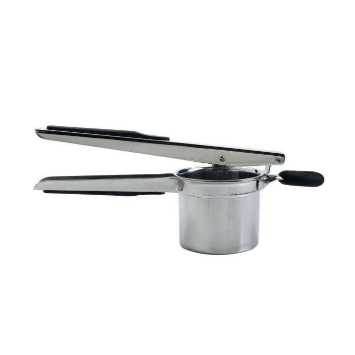 A silver OXO potato ricer with black handles and a pot resting on top.