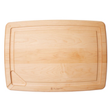 A rectangular wooden cutting board with grooves and a curved indentation on one corner, with the brand 'JK Adams' engraved near the bottom edge.