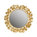 Decorative gold mirror with floral patterns on a white background