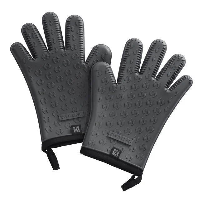 A pair of black Zwilling BBQ gloves with textured surface, designed for grilling.