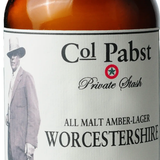 A bottle of Colonel Pabst Worcestershire sauce with a label featuring an illustration of a man in a hat and a star, indicating the brand and possibly the chef or founder associated with the product.