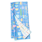 Colorful kitchen towel with utensil pattern on a white background