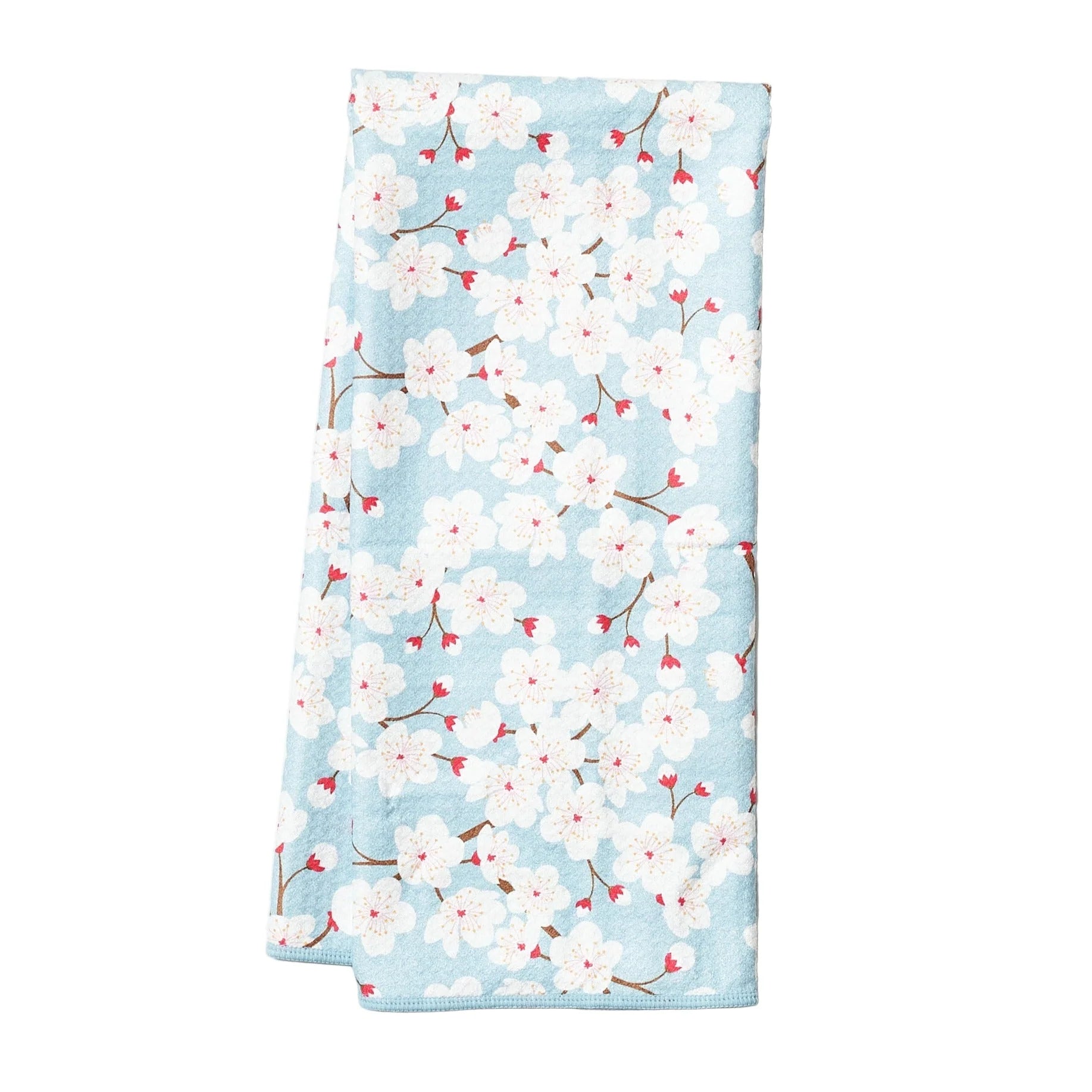 Floral patterned towel with cherry blossoms on a light blue background
