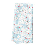 Floral patterned towel with cherry blossoms on a light blue background