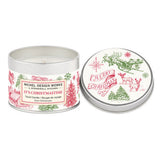 A travel candle tin with a Christmas design, including a reindeer and holiday motifs, alongside its lid which has 'Merry Christmas' text and more holiday icons.
