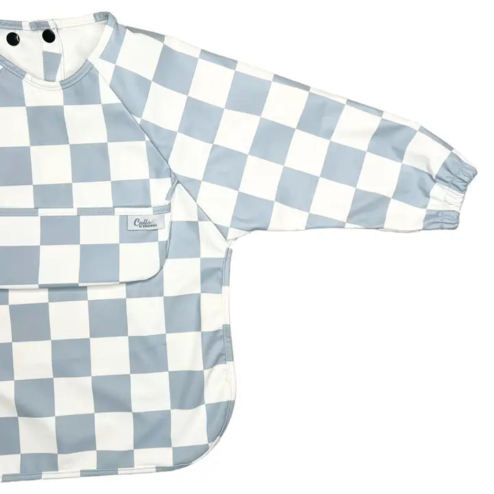 Blue and white checkered baby bib and shirt on a white background