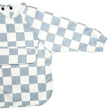 Blue and white checkered baby bib and shirt on a white background
