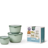 Set of green bowls with a Mepal packaging box on a white background