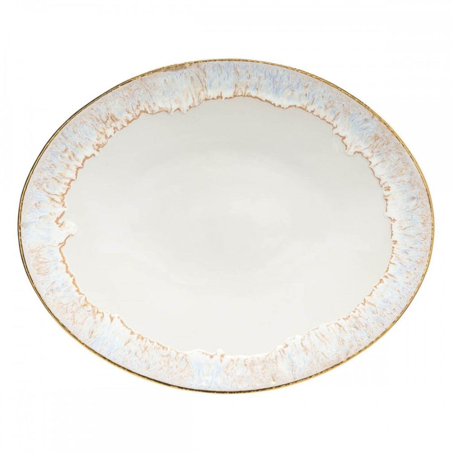 An oval-shaped serving platter with a white base color and blue-grey textured pattern around the edge.