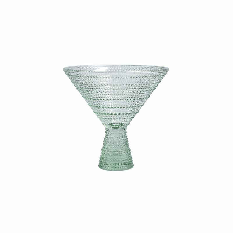 Green glass bowl with textured design on a white background