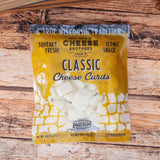 Package of Cheese Brothers Classic Cheese Curds on a wooden surface