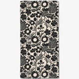Floral patterned fabric with black flowers on a white background