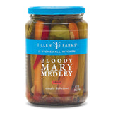 A jar of Tillen Farms Bloody Mary Medley, featuring pickled vegetables, with a blue lid and a label that includes the product name and the brand Stonewall Kitchen.
