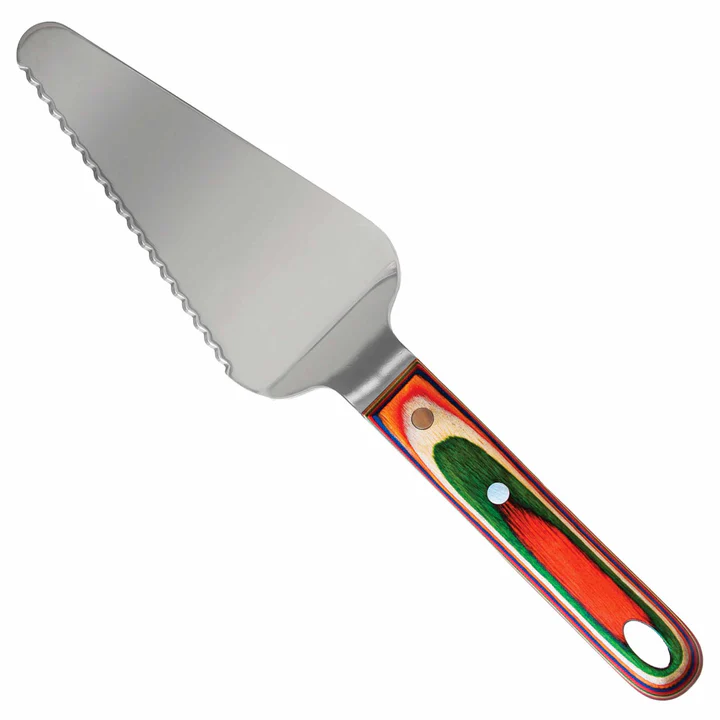 A cake server with a stainless steel blade and a handle featuring green and red colors with a decorative pattern.