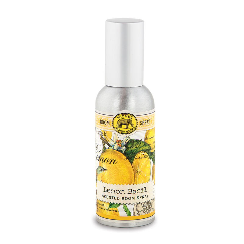 A bottle of MD ROOM SPRAY with a label showing pink grapefruit slices and leaves, indicating the scent of the room spray.