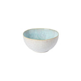 A ceramic cereal bowl with a solid blue interior and a speckled grey exterior on a white background.