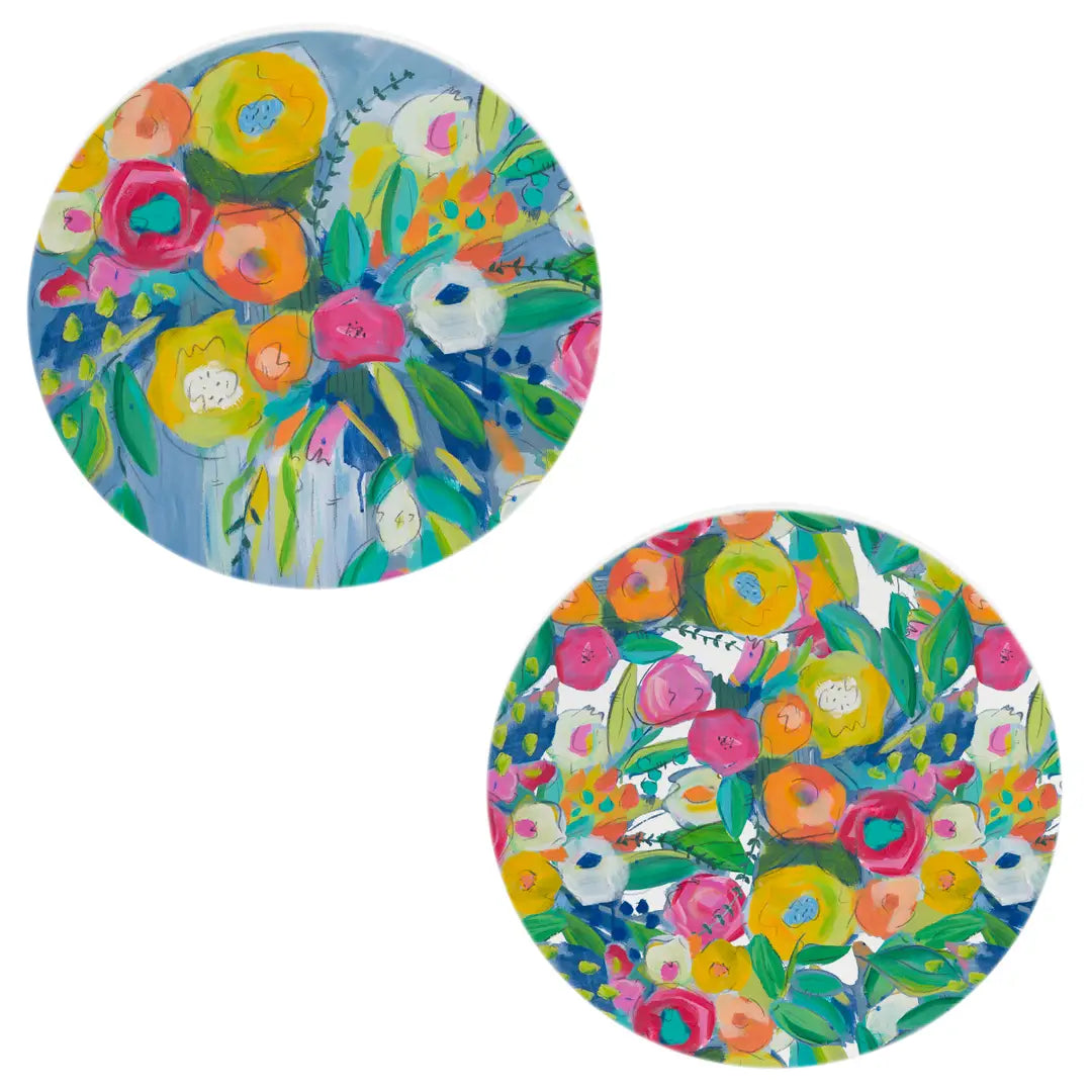 Two round, colorful paper plates with floral designs on a white background.