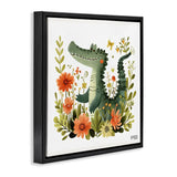 Framed wall art featuring a whimsical green alligator surrounded by orange flowers and green leaves on a white background, shown in a black floating frame against a light gray wall.
