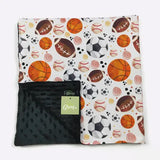Blanket with sports ball pattern and black reverse side