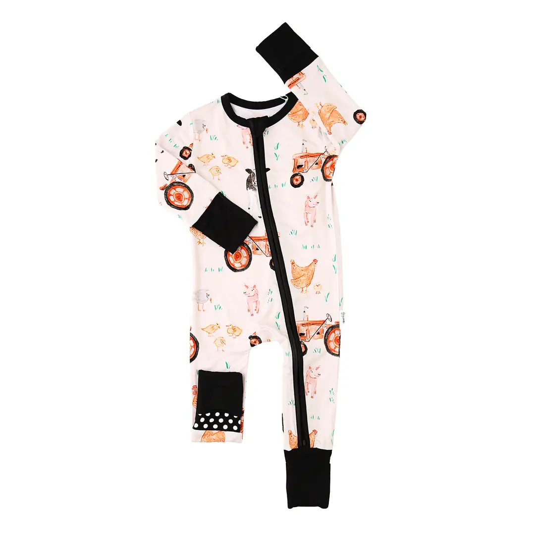 Baby onesie with car pattern and black accents on a white background