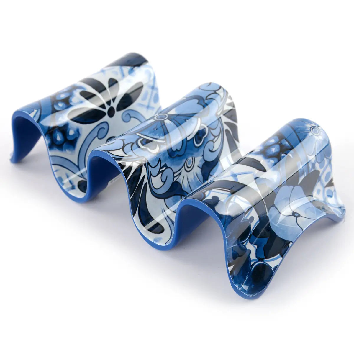 Blue and white ceramic dog toy with floral patterns on a white background