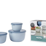 Set of blue nesting bowls with a box labeled 'Mepal' on a white background