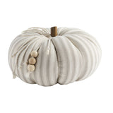 A fabric pumpkin with beige and brown striped pattern and a wooden stem.