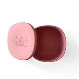 Pink container with a red interior on a white background, featuring 'Cala & Friends' branding.