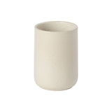 A white ceramic utensil holder with a textured exterior.