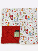 Baby blanket with road and vehicle pattern and red backside, featuring a label.