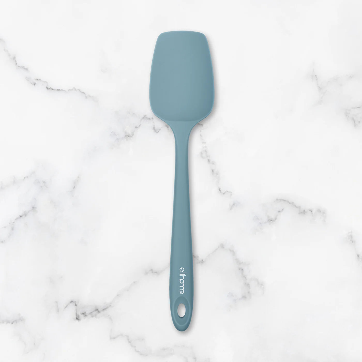 Blue spatula on a marble surface