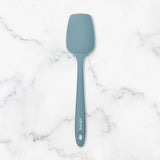 Blue spatula on a marble surface