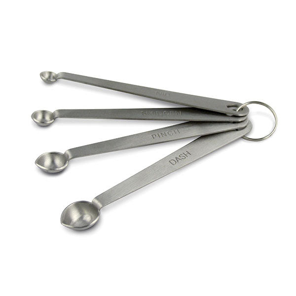 A set of four stainless steel measuring spoons with dashboard handles, labeled with measurements.