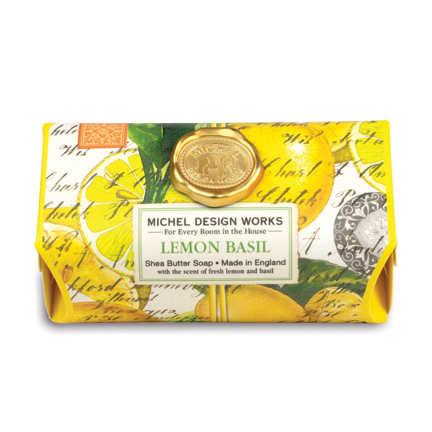A bar of shea butter soap with lemon basil design, packaged in a yellow wrapper with green basil leaves and a stamp design.