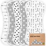 Set of four burp cloths with different patterns on a white background