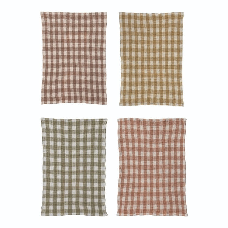 Four checkered fabric towels  in brown, beige, green, and red on a white background
