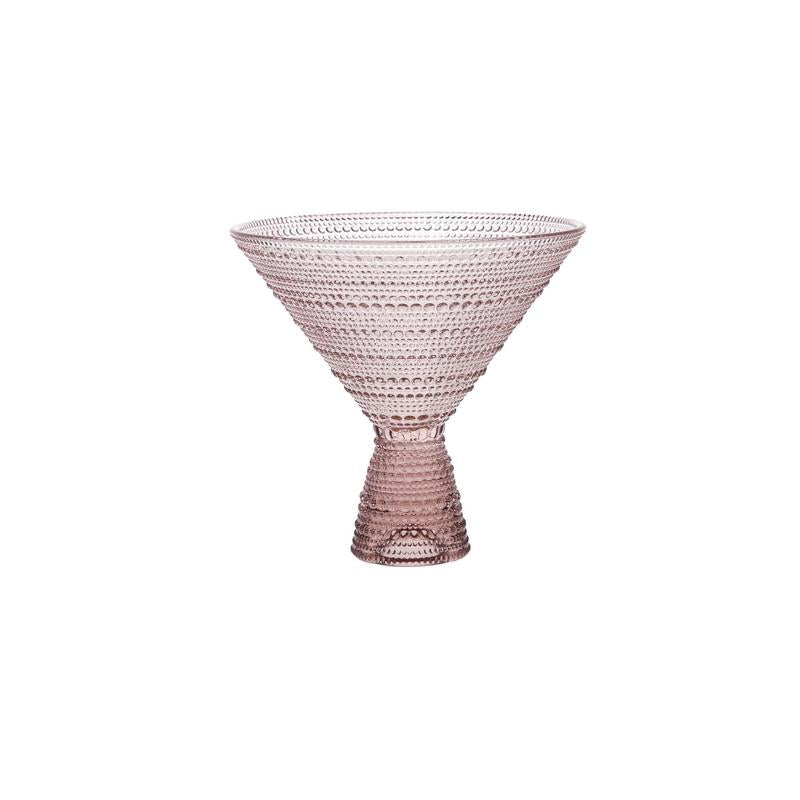 Pink glass bowl with textured design on a white background