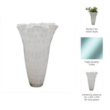 Decorative glass vase with text highlighting features on a white background