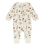 An off-white long-sleeve baby footless one-piece jumpsuit with an all-over print of cartoon bears, red trunks, and small red and brown accessories. The jumpsuit features a front zipper and ribbed cuffs on the sleeves and legs, shown against a plain white background.