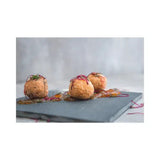 Three fried croquettes on a gray plate with a white background