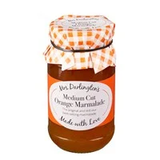 A jar of Mrs. Darlington's Medium Cut Orange Marmalade with a label and a checkered pattern on the lid.