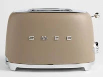 Beige toaster with 'Smeg' branding on a white background