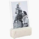 White photo frame with a black and white family photo on a white background