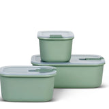 Set of three green food storage containers with lids on a white background